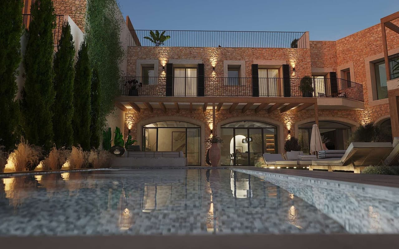 Beleuchtetes Townhouse-Ensemble in Ses Salines bei Abend mit Pool - El Cor de Ses Salines von Mallorca Home Connexion